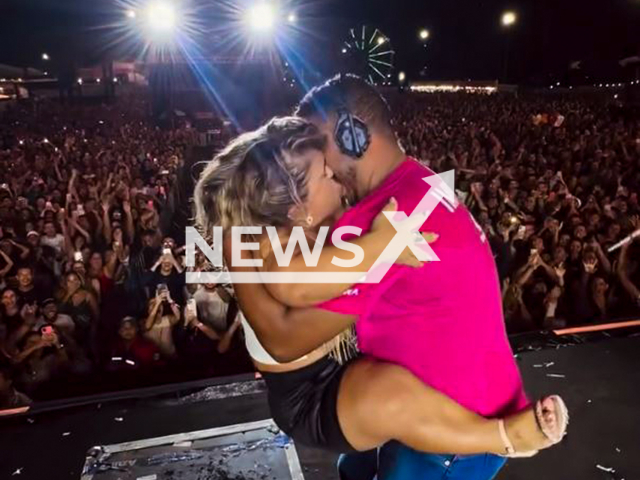 Nattan pays for a man to kiss a woman with dwarfism at a concert Sao Lourenco da Mata, Brazil, Aug. 2, 2025. The cameraman comes up and the two kiss, while Nattan laughs, holding the camera. Note: Photo is a screenshot from a video(@nattan/Newsflash/NX)