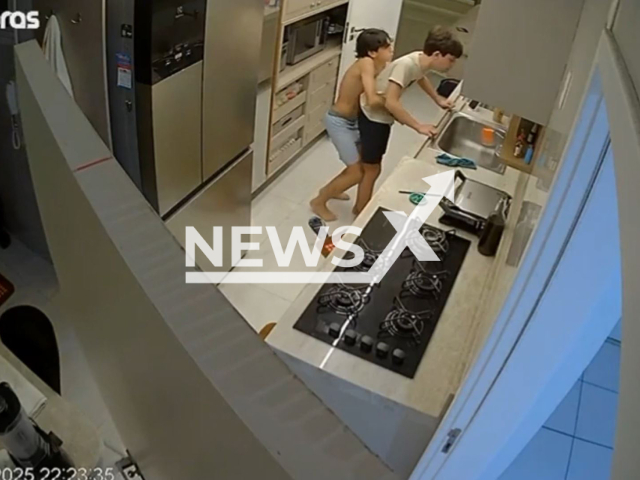 This image is a screen grab of the video supplied titled NewsX-CuzinSeved-01.mp4: Footage shows the 14 years old Silas rescuing his choaking cousin Igor Vasconcelos, 13 by performing Heimlich maneuver in the living room of an apartment in Fortaleza, Brazil on Thursday, Aug 7, 2025.(Clipzilla/NX)
