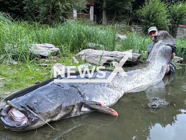 Picture shows fishing star Jakub Vagner with his latest record catch: a 2.68-meter-long catfish in the Vranov Reservoir south of Prague, Czech Republic,  undated. Note: Private photo taken from social media. (@jakubvagner_official/Newsflash/NX)