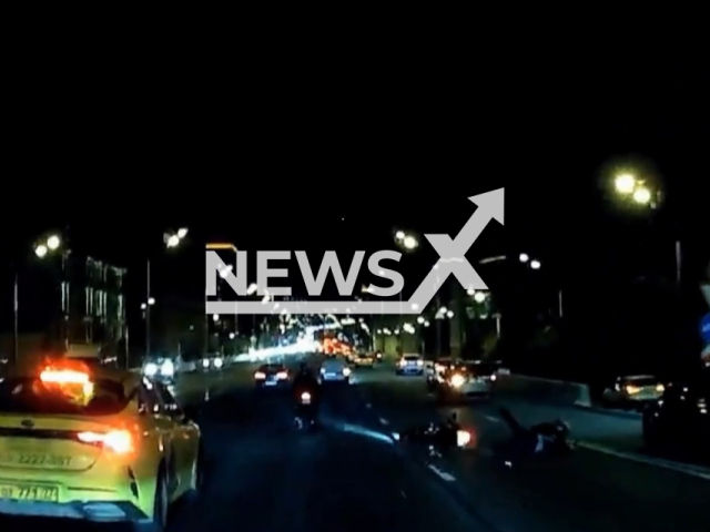 This image is a screen grab of the video supplied titled NewsX-RoadBump-01.mp4: Dash cam shows motorcyclist and bike go rolling down the road after hitting road bump on Sadovoye Near Tagansky Tunnel, Moscow, Russia on Wednesday, Aug 6, 2025.(Clipzilla/NX)