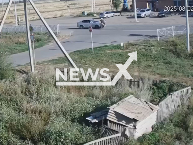 This image is a screen grab of the video supplied titled NewsX-MotorcycleSkoda-01.mp4: CCTV footage shows a 14-year-old riding a motorcycle on a secondary road, failing to give way and getting hit by a Skoda Octavia on the Orenburg–Belyaevka highway, Russia on Saturday, Aug 2, 2025.(Clipzilla/NX)