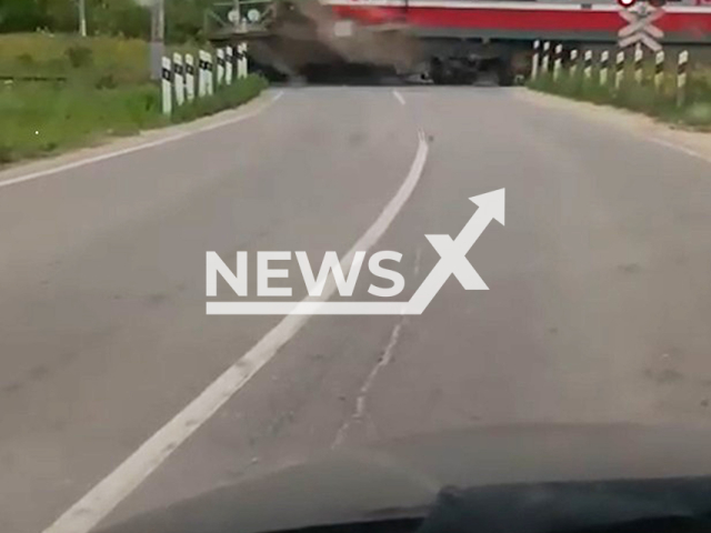 This image is a screen grab of the video supplied titled NewsX-LorryTrain-01.mp4: Footage shows the train crashing a truck that had stopped on the rails near the Mordves station in Tula Oblast, Russia on Monday, Aug 11, 2025.(Clipzilla/NX)