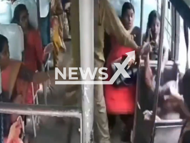 This image is a screen grab of the video supplied titled NewsX-ElderlyFall-01.mp4: CCTV shows a 74-year-old woman falling from a moving bus in Thrissur, Kerala, India on Monday, Aug 11, 2025.(Clipzilla/NX)