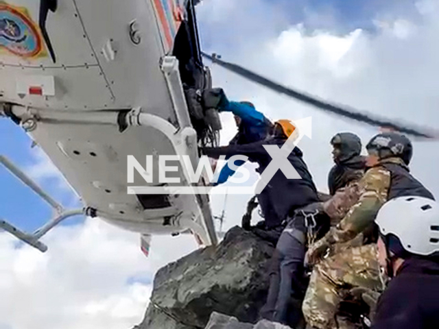 This image is a screen grab of the video supplied titled NewsX-RescueOperation-01.mp4: Footage shows rescuers evacuating a climber in harsh conditions of thin air, strong winds, and sub-zero temperatures at nearly 4,500 metres on Ordzhonikidze Peak in Kazakhstan’s Almaty Region, undated. The Ministry of Emergency Situations of the Republic of Kazakhstan shared the video on Wednesday, Aug 14, 2025.(Clipzilla/NX)