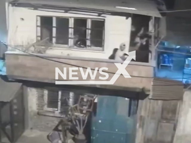 This image is a screen grab of the video supplied titled NewsX-GunWars-01.mp4: CCTV shows a gunfight erupting between feuding neighbors in Adana’s Turkocagi Neighborhood on Sunday, Aug. 10, 2025.(Clipzilla/NX)