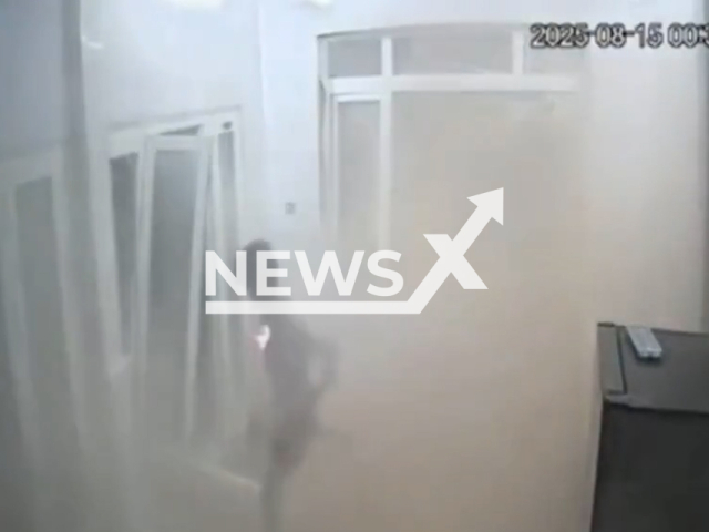 This image is a screen grab of the video supplied titled NewsX-VietBild-01.mp4: Debris almost crushes a man after a boiler suddenly exploded at a glass fact in Tan Son Nhi, Vietnam, on Aug.15,2025.(Clipzilla/NX)
