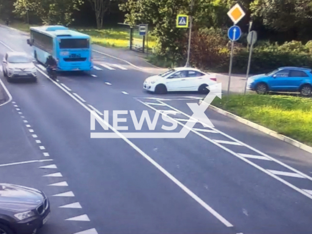 This image is a screen grab of the video supplied titled NewsX-BikerBusted-01.mp4: Biker drives in high speed in Saint Petersburg, Russia, on Aug.15,2025. He was arrested.(Clipzilla/NX)