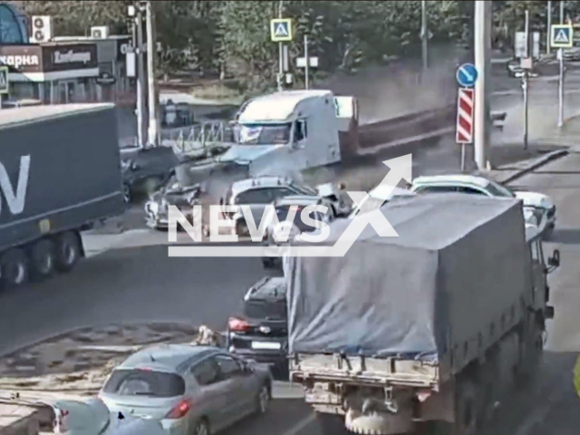 This image is a screen grab of the video supplied titled NewsX-FreightlinerRam-01.mp4: Truck rams seven cars in Volgograd, Russia, Aug. 18, 2025. According to preliminary information, the truck's brakes failed.(Clipzilla/NX)