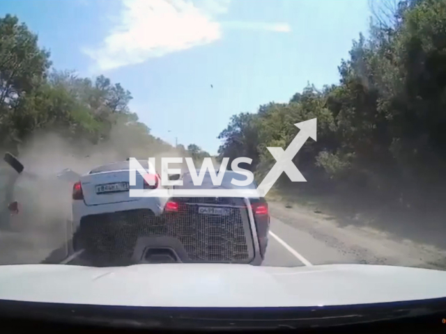 This image is a screen grab of the video supplied titled NewsX-CarsNear-01.mp4: A BMW driver collides with five vehicles on the Dzhubga-Sochi highway in Tuapse, Russia, on Aug.19,2025.(Clipzilla/NX)
