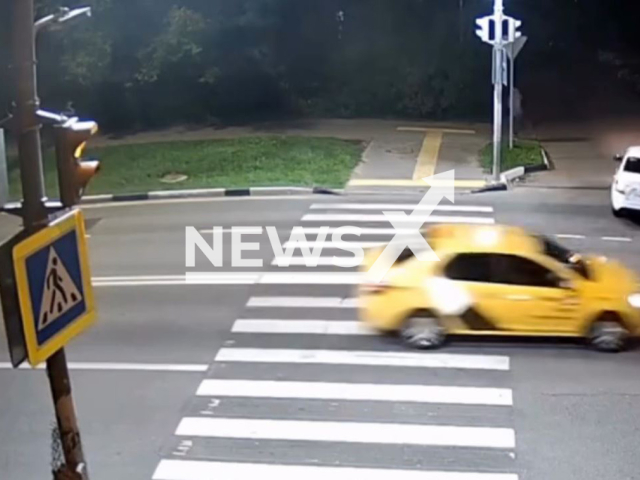 This image is a screen grab of the video supplied titled NewsX-SuddenHit-01.mp4: A car hits a biker in Odintsovo, Russia, on Aug.08,2025.