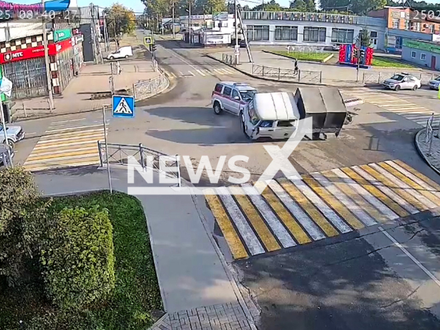 This image is a screen grab of the video supplied titled NewsX-TwoCollide-01.mp4: An SUV of the Russian National Guard and a UAZ of the Rostelecom company collide in Toguchin, Russia, on Aug.21, 2025.