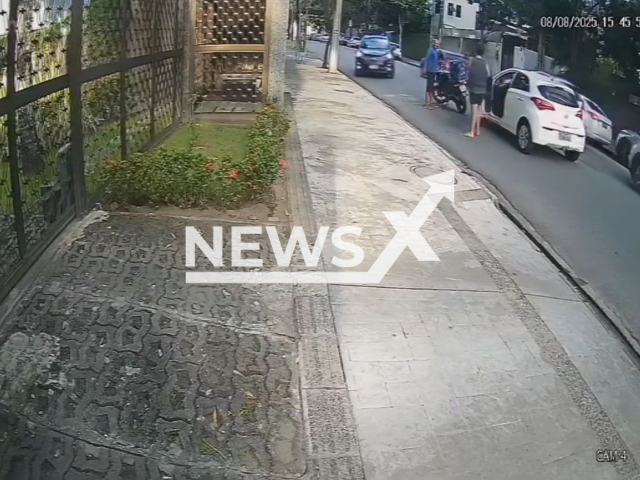 A driver and a motorcyclist fight after a traffic accident and make peace in the North Zone of Recife, Brazil, on Aug. 08,2025. Note: Photo is a screenshot from a video(Newsflash/NX)