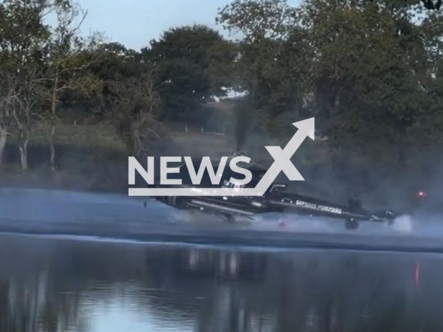 This image is a screen grab of the video supplied titled NewsX-WaterScoop-01.mp4: Footage shows a water-bombing helicopter crashing into a lake in Rosporden, Finistere department of Brittany in north-western France on Sunday, Aug 24, 2025. (Clipzilla/NX)