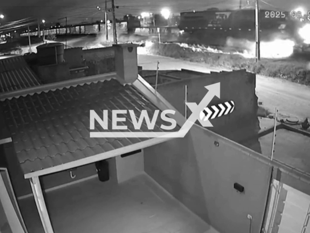 This image is a screen grab of the video supplied titled NewsX-DriverTrein-01.mp4: CCTV shows train hitting and drugging a vehicle almost 30 meters in Curitiba, Parana, Brazil on Sunday, Aug 24, 2025.(Clipzilla/NX)