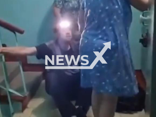 This image is a screen grab of the video supplied titled NewsX-DrunkElectricity-01.mp4: A drunk repairman cut off power to an entire floor while trying to fix the light in an apartment in Kursk, Russia, undated. Footage shared on VKontakte on Sunday, Aug 24, 2025.(Clipzilla/NX)