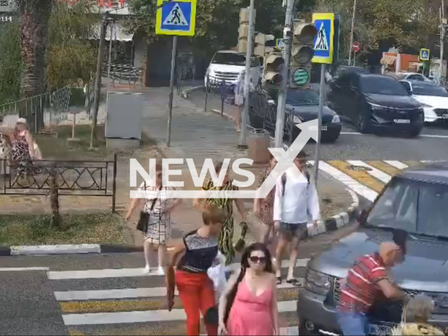 This image is a screen grab of the video supplied titled NewsX-PedalsMix-01.mp4: Footage shows a 56-year-old Land Rover driver, turning right and hitting pedestrians on a zebra crossing in Sochi, Russia on Tuesday, Aug 19, 2025.(Clipzilla/NX)
