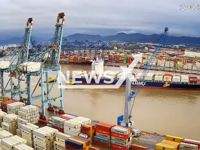 This image is a screen grab of the video supplied titled NewsX-ShipDrif-01.mp4: CCTV footage shows tugboats racing to stop a massive cargo ship that broke free and drifted in the river after its mooring cables snapped at the Port of Itajai, Santa Catarina, Brazil  on Wednesday, Aug 27, 2025.(Clipzilla/NX)