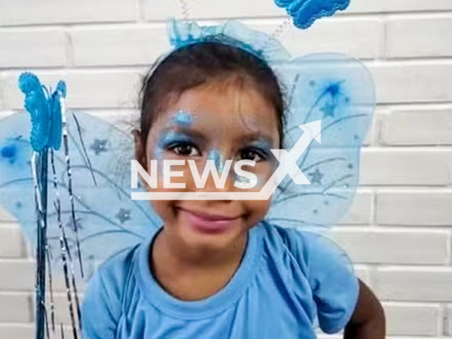 Emanuelly Victoria Souza Moura, 6, poses in undated photo. She was raped and killed in Campo Grande, Brazil. Note: Private photo. (Newsflash/NX)