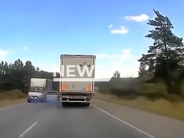 This image is a screen grab of the video supplied titled NewsX-OncomingHit-01.mp4: Footage shows overtaking car being hit by the truck on M-5 Ural highway near Zlatoust in the Chelyabinsk region, Russia on Sunday, Aug 24, 2025.(Clipzilla/NX)