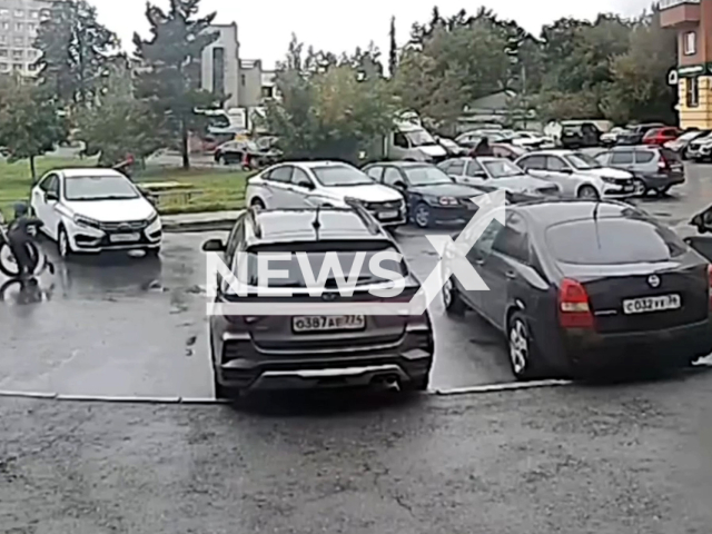 This image is a screen grab of the video supplied titled NewsX-FleeHit-01.mp4: Footage shows  a pit bike driver hitting a child on a scooter in the courtyard of a residential building and flees in Chelyabinsk, Russia on Sunday, Aug 31, 2025. 
 (Clipzilla/NX)