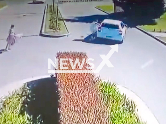 This image is a screen grab of the video supplied titled NewsX-TexiDrive-01.mp4: Footage shows man trying to stop the vehicle after the driver decides to flee with the belongings of both travelers including the suitcases, electronic devices and all their documentation in Hudson, Buenos Aires province, Argentina on Friday, Aug 29, 2025.(Clipzilla/NX)
