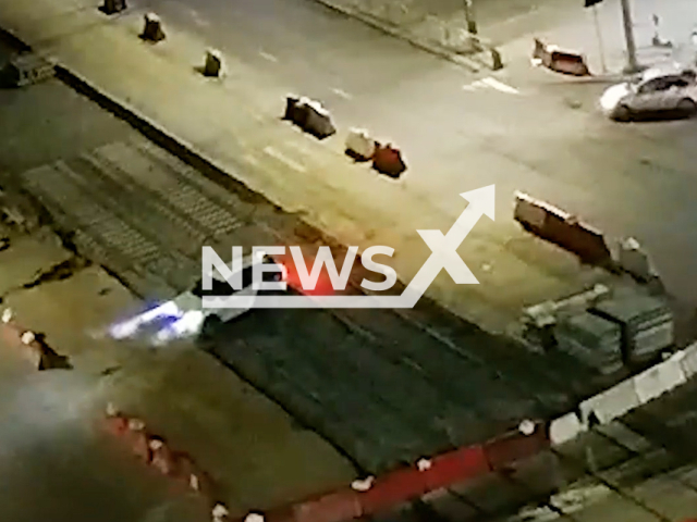 This image is a screen grab of the video supplied titled NewsX-DriveRepair-01.mp4: Footage shows 3 cars get stuck on tram tracks under repair in Chelyabinsk, Russia on Saturday, Aug 30, 2025.(Clipzilla/NX)