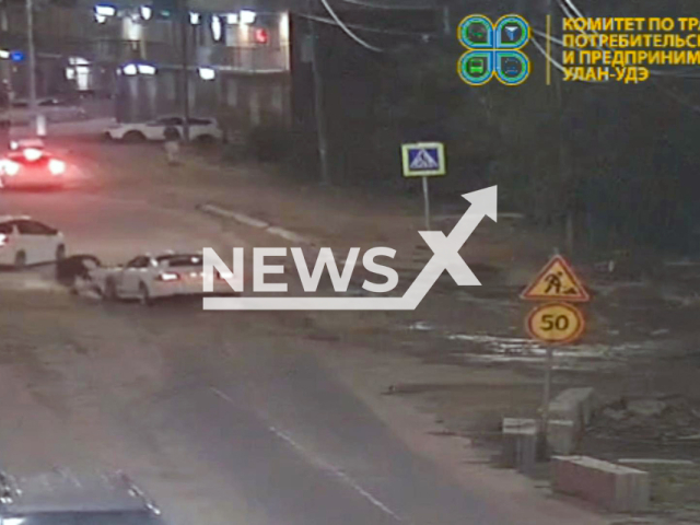 This image is a screen grab of the video supplied titled NewsX-PedestRun-01.mp4: CCTV footage shows a Toyota Celica driven by an unlicensed 23-year-old man intentionally hitting a 43-year-old pedestrian on Modogoeva Street before fleeing in Ulan-Ude, Buryatia, Russia on Sunday, Aug 31, 2025.(Clipzilla/NX)