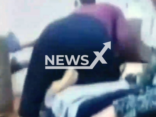 Grandmother beats grandson in Konak, Izmir in Turkey, undated. She was taken into custody. Note: Photo is a screenshot from a video. (Newsflash/NX)