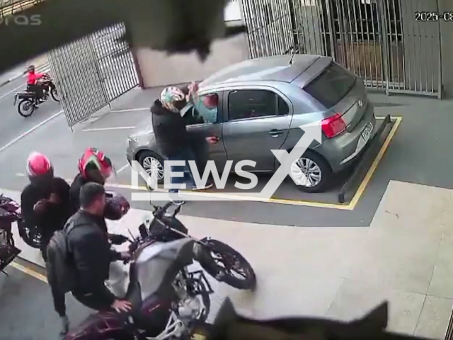 This image is a screen grab of the video supplied titled NewsX-CrimeRobery-01.mp4: CCTV footage shows four armed thieves attempting to steal a car and motorcycle in a parking lot before their plan fails and an off-duty police officer opens fire, forcing them to flee in Sao Paulo, Brazil on Saturday,  Aug 23, 2025.(Clipzilla/NX)