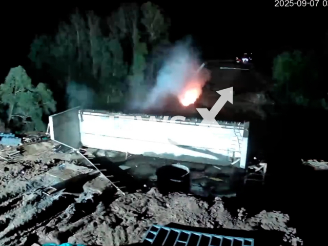 This image is a screen grab of the video supplied titled NewsX-MidFlames-01.mp4: CCTV footage shows a car ramming into a support pillar of a bridge under construction  before catching fire and plunging into the Bystry Tanyp River in the Buraevsky district of Bashkiria on Sunday, Sep. 7, 2025.(Clipzilla/NX)