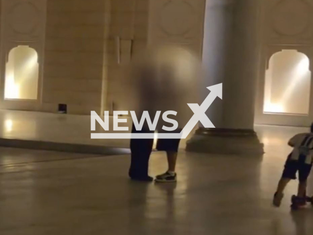 This image is a screen grab of the video supplied titled NewsX-RussianCouple-01.mp4: Footage shows Russian couple kissing in the courtyard of the Buyuk Γamlica Mosque in Istanbul, Turkey on August 26th 2025. The Russian couple was detained and now faces up to one year in prison.(Clipzilla/NX)