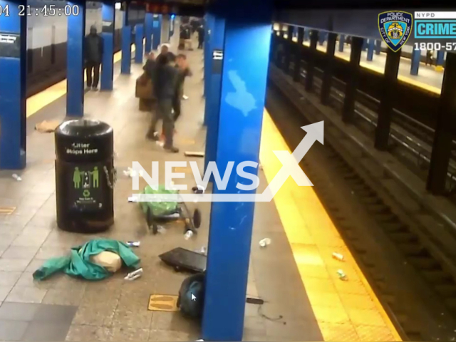 Knife-wielding assailant slashed a 52-year-old homeless man in the chest and head on the Brooklyn subway platform in New York, USA. Note: Photo is a  screenshot from the video (@NYPDnews/Clipzilla)