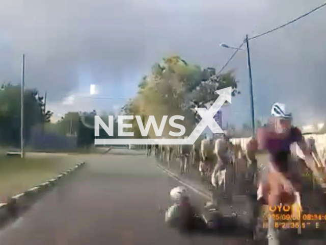 This image is a screen grab of the video supplied titled NewsX-RideLeng-01.mp4: Footage shows a cyclist being hit and killed during a rase in Langkawi, Malaysia on Saturday, Sep. 6, 2025.(Clipzilla/NX)