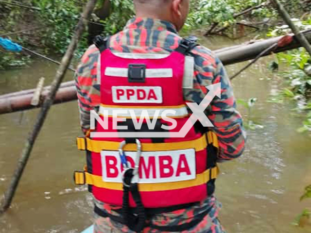 Rescuers search for Tuah Lamat, believed to have been attacked by a crocodile while bathing in a river in Lawas, Malaysia, on Tuesday, 9 September 2025. His head was later found by villagers. Note: Licensed photo. (Sarawak Fire and Rescue Department/Newsflash/NX)