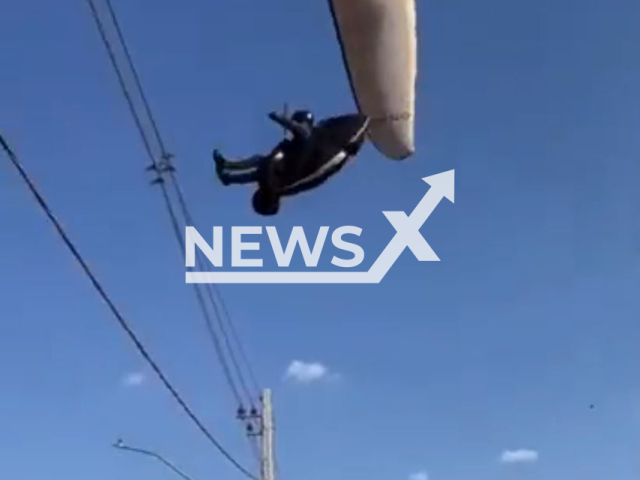 A paragliding pilot falls onto the power grid in Divinopolis, Brazil, on Sept.07,2025. He was unharmed. Note: Photo is a screenshot from a video(Newsflash/NX)