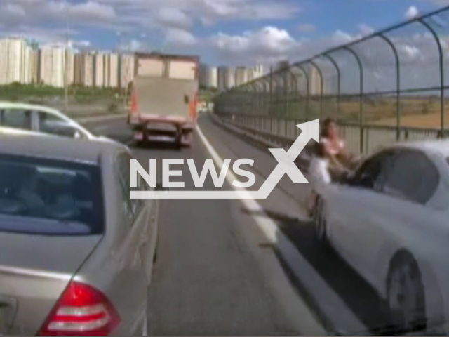 Car hits woman who ran to help a stuck kitten on a roadside fence in Avcilar, Turkey, undated. The cat jumped over the fence and fled. Note: Photo is a screenshot from a video(Newsflash/NX)