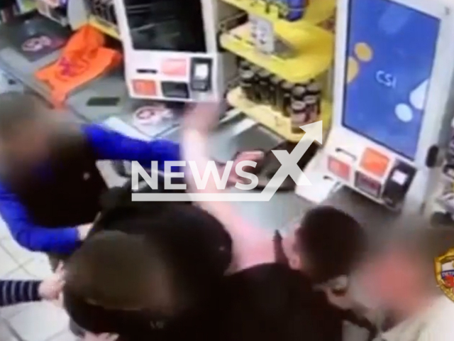 This image is a screen grab of the video supplied titled NewsX-PeaceBottle-01.mp4: Footage shows during a fight in the store attacker hits man on the head with a bottle in Moscow, Russia on Thursday, Sep. 11, 2025.(Clipzilla/NX)