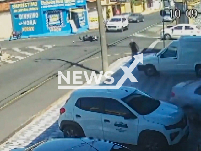 This image is a screen grab of the video supplied titled NewsX-BikeStores-01.mp4: CCTV footage shows a motorcycle carrying a woman and her 13-year-old niece being struck, and leading the elderly car driver mistakenly accelerate into a cleaning supply store in  Franca, Sao Paulo, Brazil on Wednesday, Sep. 10, 2025.(Clipzilla/NX)
