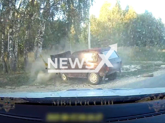 This image is a screen grab of the video supplied titled NewsX-HighChase-01.mp4: Footage shows officers chasing a 33-year-old driver of a Niva, who repeatedly drove into oncoming traffic before crashing into a tree and being arrested in the after resisting with a knife in the Kovrovsky District, Vladimir Oblast, Russia, undated. Russian Ministry of Internal Affairs released the footage on Tuesday, Sep. 16, 2025.(Clipzilla/NX)