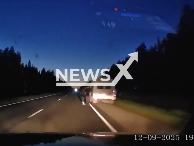 This image is a screen grab of the video supplied titled NewsX-FuelRefuel-01.mp4: Footage shows car hitting a man refueling his van on an unlit section of the road in Arkhangelsk Oblast, Russia on Friday, Sep. 12, 2025.(Clipzilla/NX)