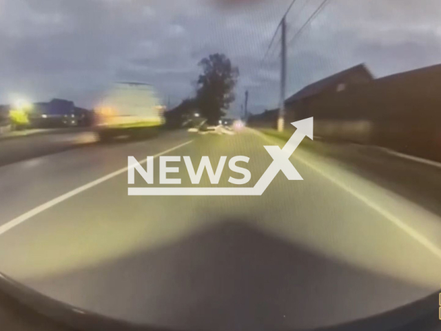 This image is a screen grab of the video supplied titled NewsX-PaperFire-01.mp4: Dashcam footage shows the Gazelle driver turning left and cutting off a 17-year-old motorcycle driver, causing it to overturn and crash into an oncoming Changan Uni-K in Novokuznetsk, Russia on Sunday, Sep. 14, 2025.(Clipzilla/NX)