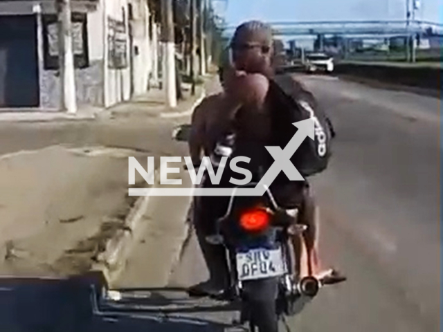 This image is a screen grab of the video supplied titled NewsX-CheisBikers-01.mp4: Footage shows couple on motorcycle crashes while fleeing from Federal Highway Police on the Washington Luiz Highway in Duque de Caxias, in Baixada Fluminense, Brazil on Sunday, Sep. 21, 2025. (Clipzilla/NX)