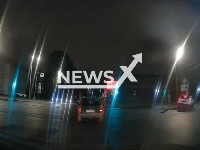 This image is a screen grab of the video supplied titled NewsX-PoleFast-01.mp4: Dashcam shows a carsharing vehicle attempting a fast right turn at an intersection, losing control and crashing into a traffic light pole  in St. Petersburg, Russia on Monday, Sep. 15, 2025.(Clipzilla/NX)