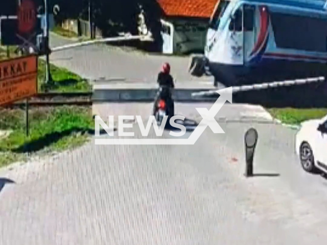 This image is a screen grab of the video supplied titled NewsX-TrainCrashMotorcycle-01.mp4: Footage shows a passenger train hitting motorcycle in Zonguldak, Turkey on Tuesday, Sep. 23, 2025.(Clipzilla/NX)