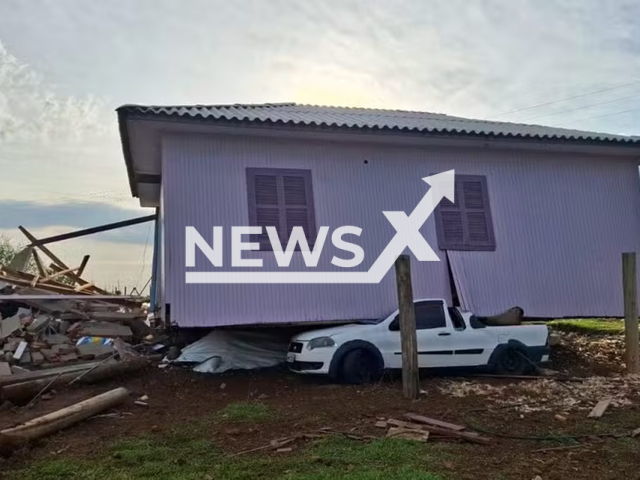 Picture shows the wooden house which ended up on top of a car during a storm in Barra Bonita, SC, Brazil, undated. The incident occurred on Sep. 20, 2025. Note: Photo from Civil Defense. (Defesa Civil/Newsflash/NX)