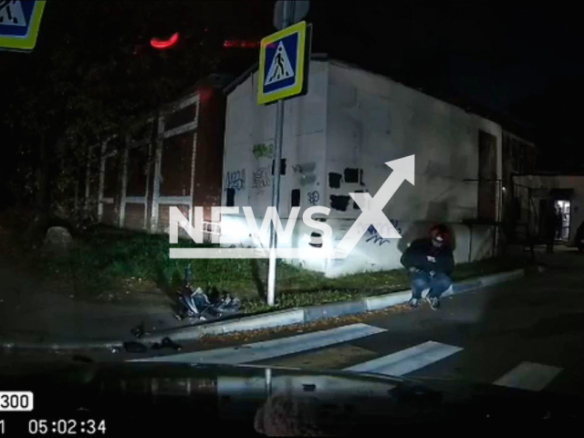 This image is a screen grab of the video supplied titled NewsX-UnlicensedBiker-01.mp4: Dashcam shows biker crashing and flying over the car in Tver, Russia on Monday, Sep. 22, 2025.(Clipzilla/NX)