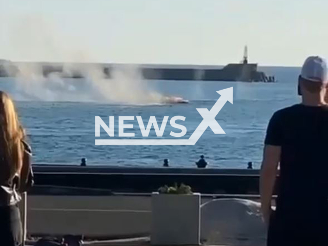 This image is a screen grab of the video supplied titled NewsX-TuapseDrone-01.mp4: Footage shows onlookers watching and filming naval drone attack in Tuapse, Krasnodar Krai, Russia on Thursday, Sep. 24, 2025.(Clipzilla/NX)