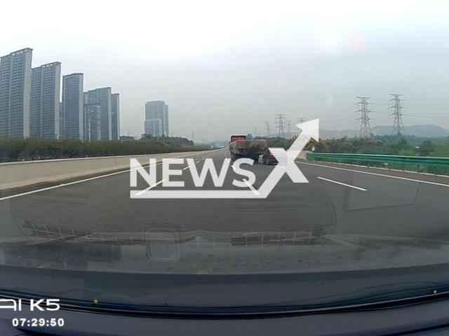 A car rear-ends truck and gets dragged for nearly 500metres on Wuhan road in China, Sep. 22, 2025. The incident was captured by a dash cam. Note: Photo is a screenshot from a video(AsiaWire/NX)