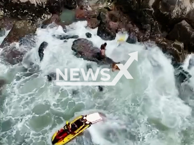 This image is a screen grab of the video supplied titled NewsX-GirlSwep-01.mp4: Footage shows a 10-year-old girl is rescued from the rocks on the shore on Enseada Beach, in Guaruja,  Sao Paulo, Brazil on Sunday, Sep. 28, 2025.(Clipzilla/NX)