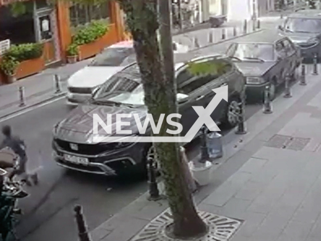 This image is a screen grab of the video supplied titled NewsX-PavementCrash-01.mp4: Surveillance video shows a car hitting a child and losing control and crashing into a tree in Bayrampasa, Istanbul, Turkey on Wednesday, Sep. 17, 2025.(Clipzilla/NX)